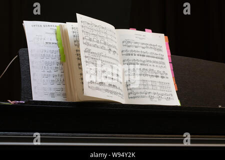 music sheets on a music stand on a piano of the Operette Fledermaus from Johann  Strauss Stock Photo