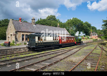 Steam locomotive pulling train out of Rowley railway station in Beamish open air museum near Stanley in County Durham North East England. Stock Photo