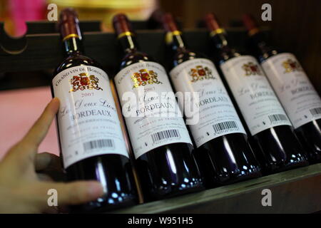 --File--Bottles of imported wine are for sale at a supermarket in Haikou city, south Chinas Hainan province, 24 June 2011.    Foreign wine imports are Stock Photo