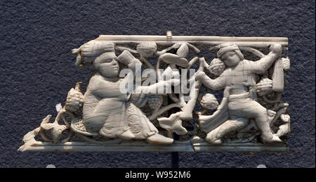 Decorative plaques Islamic Art Egypt, Le Claire, 11th century, They illustrate the princely pleasures, drinks, music, dance, hunting scene. (Ivory and openwork carving) Stock Photo