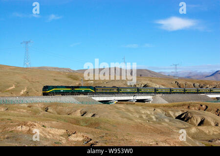 --FILE--A passenger train travels on the Qinghai-Tibet Railway in the Kunlun Mountain area in northwest Chinas Qinghai province, 13 August 2011.   Chi Stock Photo