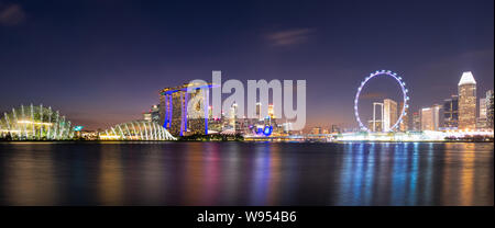 Panorama view of downtown business buildings area at night in Singapore.Singapore is a world famous tourist city. Stock Photo