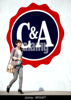 --File--A pedestrian walks past the logo of C&A in Beijing, China, 18 April 2011.   Montblanc and C&A sunglasses were put on the substandard list of t Stock Photo