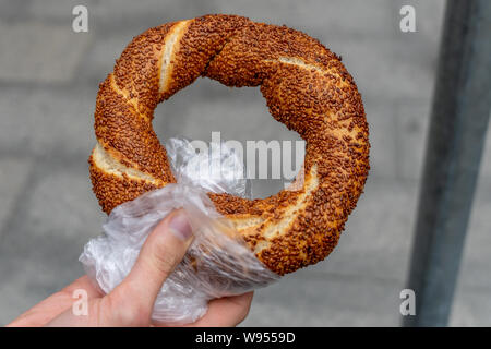 Simit is a circular bread, typically encrusted with sesame seeds or, less commonly, poppy, flax or sunflower seeds, found across the cuisines of the f