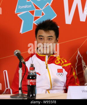 Silver medalist Wang Hao of China attends a press conference after being defeated by his compatriot Zhang Jike in the final of the mens singles table Stock Photo