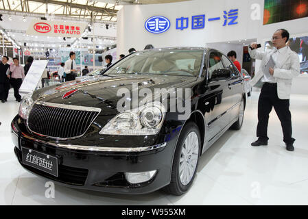 --FILE--Visitors look at a Hongqi (Red Flag) Shengshi of FAW, formerly called Hongqi HQ3, at the 13th Shanghai International Automobile Industry Exhib Stock Photo