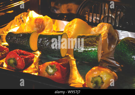 Healthy food. Pepper and zucchini with a ruddy crust are prepared in the oven. Close-up. Grilled vegetables Stock Photo