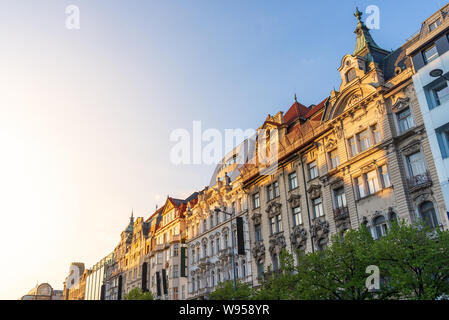 Outdoor close up sunny view of beautiful exterior Art Nouveau facade  and hotel logo signs on buildings around Wenceslas Square. Stock Photo