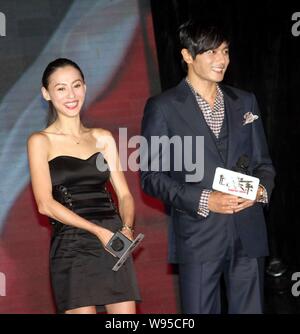 Hong Kong actress Cecilia Cheung and South Korean actor Jang Dong-gun speak at the press conference for their new movie, Dangerous Liasons, during the Stock Photo