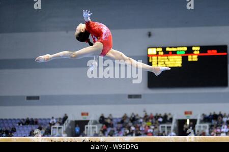 Chinas gymnast Yao Jinnan competes at the womens balance beam event during the Gymnastics World Cup Zibo 2012 in Zibo city, east Chinas Shandong provi Stock Photo