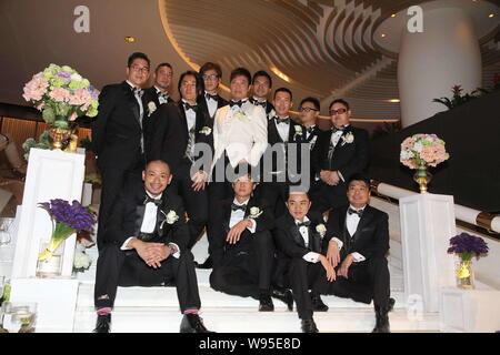 Hong Kong actor Chin Ka Lok, center, poses with his groomsmen during his wedding ceremony in Hong Kong, China, Thursday, 15 November 2012.   Hong Kong Stock Photo