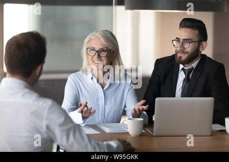 Smiling hr managers holding interview with good job applicant Stock Photo