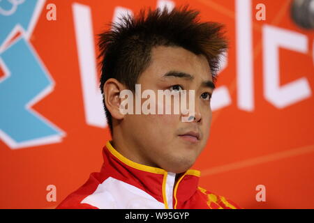 Silver medalist Wang Hao of China attends a press conference after being defeated by his compatriot Zhang Jike in the final of the mens singles table Stock Photo