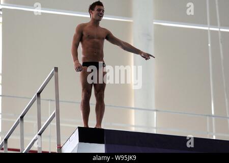 Olympic diving bronze medalist Thomas Daley of Britain prepares for diving during a training and demonstration session to coach young Chinese and Brit Stock Photo