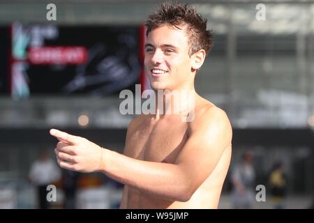 Olympic diving bronze medalist Thomas Daley of Britain reacts during a training and demonstration session to coach young Chinese and British diving fa Stock Photo