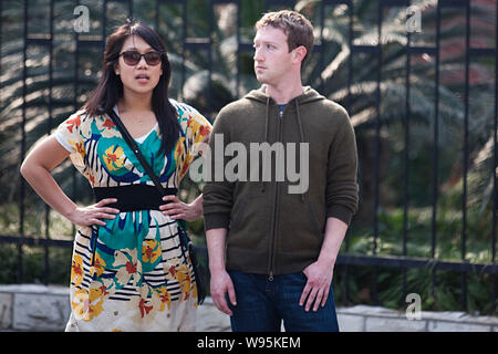 Mark Zuckerberg, founder and CEO of Facebook, is pictured with his girlfriend Priscilla Chan on a street in Shanghai, China, 27 March 2012.    Faceboo Stock Photo