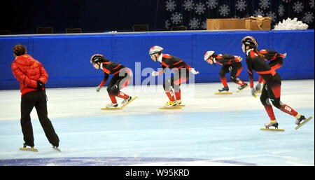 Members of the Chinese national short track speed skating team exercise during a training session for the 2012 ISU Short Track Speed Skating Champions Stock Photo
