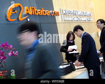 --FILE--People visit the headquarters of Alibaba Group in Hangzhou city, east Chinas Zhejiang province, 16 March 2012.   Alibaba.com, the business-to- Stock Photo