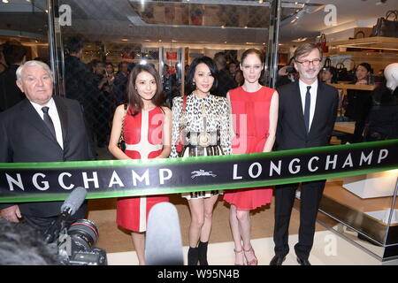 Hong Kong actor Carina Lau, center, Chinese actress Gao Yuanyuan, second left, Canadian model Coco Rocha, second right, and other guests pose at the o Stock Photo