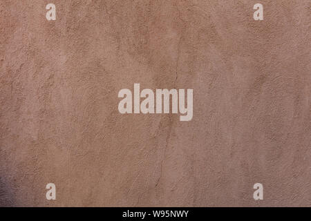 Wall plastered and painted background texture. Exterior building wall facade brown color blank empty, copy space Stock Photo