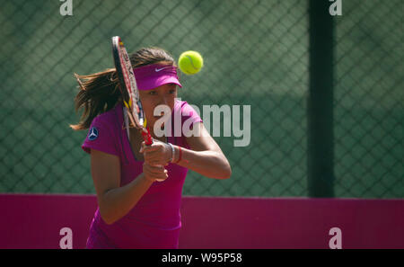 Chinese tennis player Zhang Shuai returns a shot during a training session for Fed Cup in Shenzhen, south Chinas Guangdong province, 31 January 2012. Stock Photo