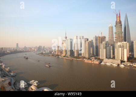 The Shanghai Tower (center) is under construction next to Jinmao Tower (left) and the Shanghai World Financial Center in the Lujiazui Financial Distri Stock Photo