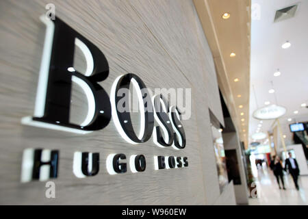 FILE--Shoppers walk past the fashion store of Louis Vuitton (LV) at Deji  Plaza in Nanjing city, east Chinas Jiangsu province, 9 September 2013. Lu  Stock Photo - Alamy