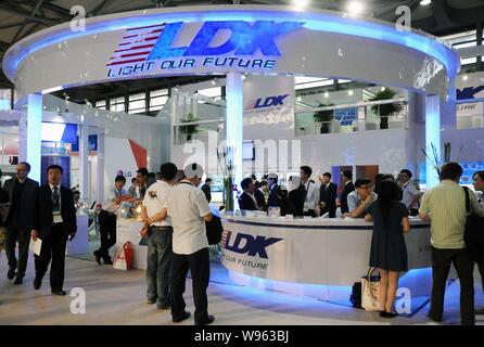 --File--People visit the stand of LDK Solar during a fair in Shanghai, China, 16 May 2012.    LDK Solar, the top polysilicon supplier in China and Asi Stock Photo