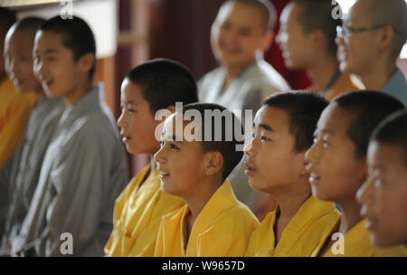 Chinese Buddhist monks and nuns of Guangxuan Art Troupe practice vocal sound during a training session at Tiantai Temple on Tiantai Mountain in HongAn Stock Photo