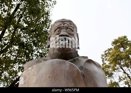 A statue of Laozi (Lao Tzu), the ancient Chinese philosopher popping his tongue out is placed at the Suzhou Culture and Arts Center in Suzhou city, ea Stock Photo