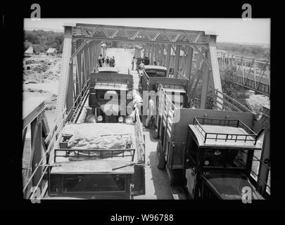 Allenby Bridge. Trucks on either side of the bridge Stock Photo