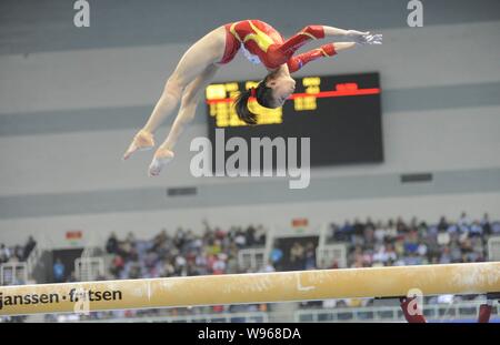 Chinas gymnast Yao Jinnan competes at the womens balance beam event during the Gymnastics World Cup Zibo 2012 in Zibo city, east Chinas Shandong provi Stock Photo