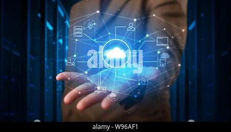 Man holding hologram projection displaying cloud technology symbols Stock Photo