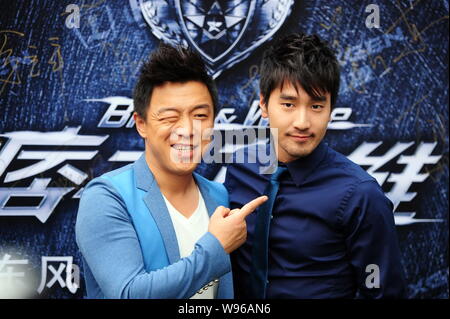 Chinese actor Huang Bo poses with Taiwanese actor Mark Chao during the premiere carnival for their new movie, Black and White, in Beijing, China, 20 J Stock Photo