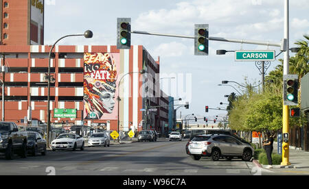 Las Vegas downtown with street lamps and crossings, a mural with Show Girl graffiti's design in the foreground, creating the sense of unreal world's best. Stock Photo