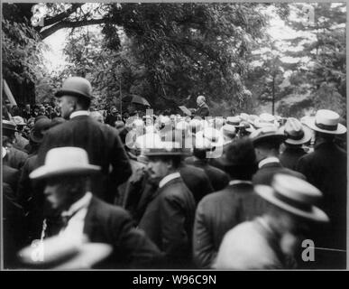 Alton Brooks Parker, 1852-1926, half length, standing, facing left making speech to large group of men Stock Photo