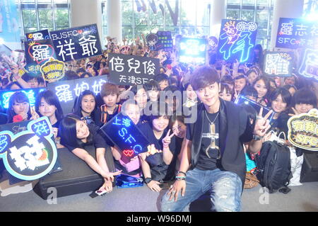 Taiwanese singer Show Lo poses with fans during the album signing meeting in Beijing, China, 11 June 2012. Stock Photo