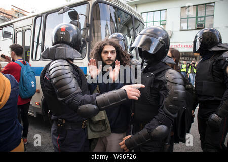 Moscow, August 10 2019. Riot police officers detain a participant of an unsanctioned walk after meeting Stock Photo