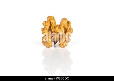 One whole ripe brown walnut without shell isolated on white background Stock Photo