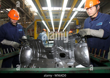 --FILE--Chinese factory workers manufacture auto parts at the pant of Geely in Ningbo city, east Chinas Zhejiang province, 24 February 2012.   Chinas