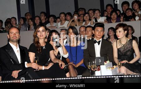 New bond girl, French actress Berenice Marlohe, second left, Taiwanese actor Nicky Wu, second right, and Chinese actress Sun Li, right, attend the ope Stock Photo