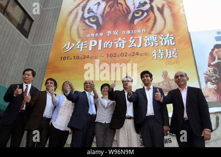 Taiwanese director Ang Lee, right third, Indian actor Suraj Sharma right second, poses during a press conference for the 3D movie, Life of Pi, in Taip Stock Photo