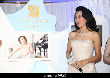 Hong Kong actress Lee Mei-Fung poses as she attends a promotional event for Estee Lauder in Hong Kong, China, 24 September 2012. Stock Photo