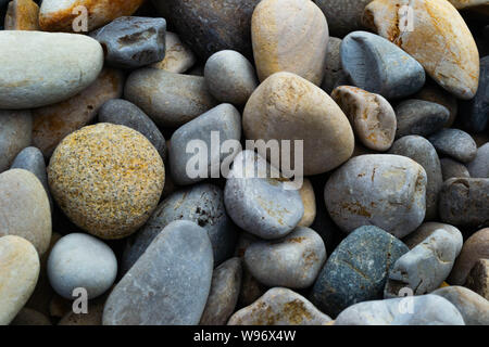 close up background of muilticolored beach rocks Stock Photo