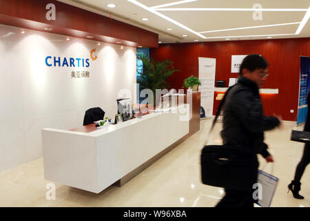 --FILE--People visit a branch of Chartis in Shanghai, China, 12 March 2010.   CHARTIS, the property and casualty arm of American International Group ( Stock Photo
