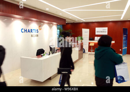 --FILE--People visit a branch of Chartis in Shanghai, China, 12 March 2010.   CHARTIS, the property and casualty arm of American International Group ( Stock Photo