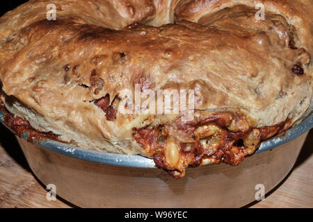 Casatiello, traditional neapolitan easter salty cake with mixed diced cheeses and cured meat Stock Photo