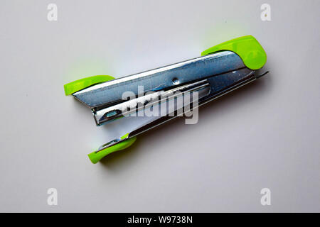 Close up Green stapler isolated on a white backgroundClose up Green stapler isolated on a white background Stock Photo
