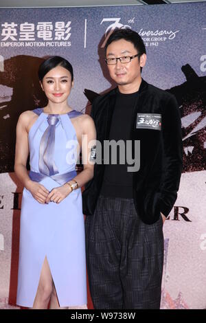 Chinese actress Qin Lan (left), director Lu Chuan poses at the premiere of the movie, The Last Supper, in Hong Kong, China, 19 December 2012. Stock Photo