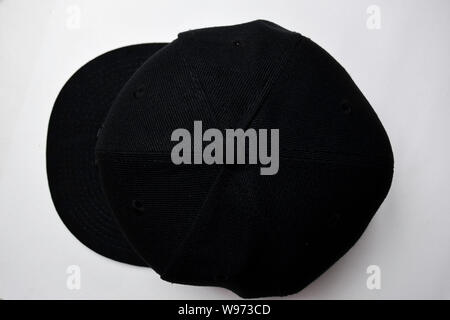 Close up baseball snap back cap color black isolated on a white background Stock Photo